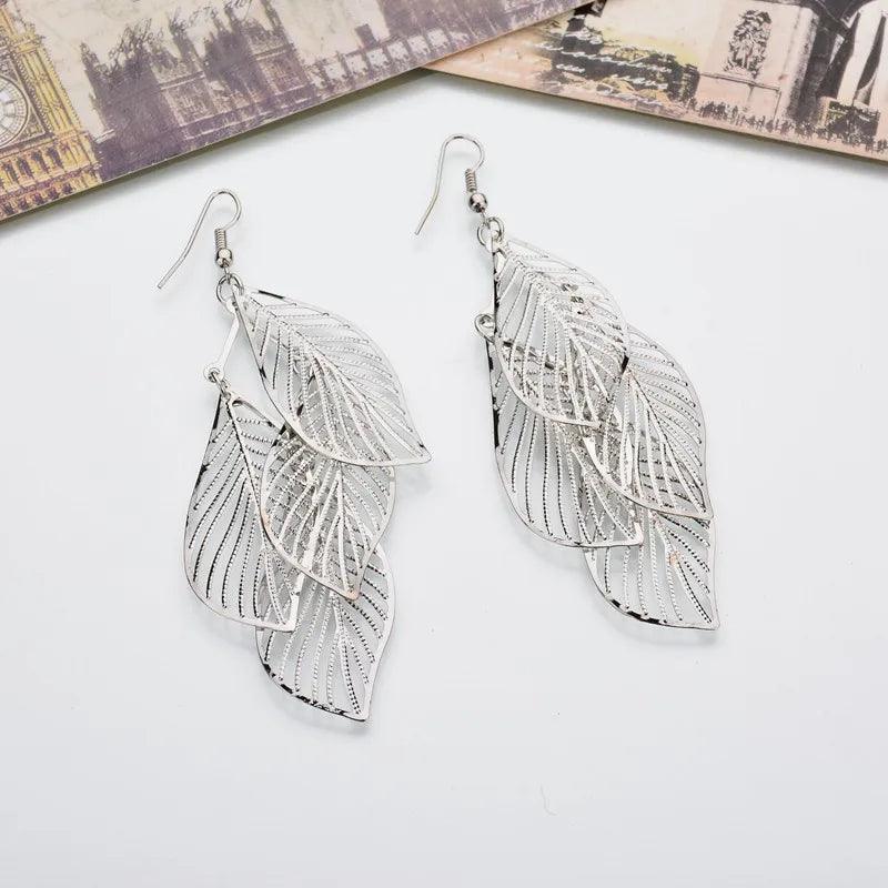 2024 Blue And White Metal Leaf Earrings Women's - Trendy Mix