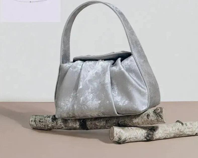 Sustainable Elegance Satin Cowhide Dumpling Handbag - Trendy Mix